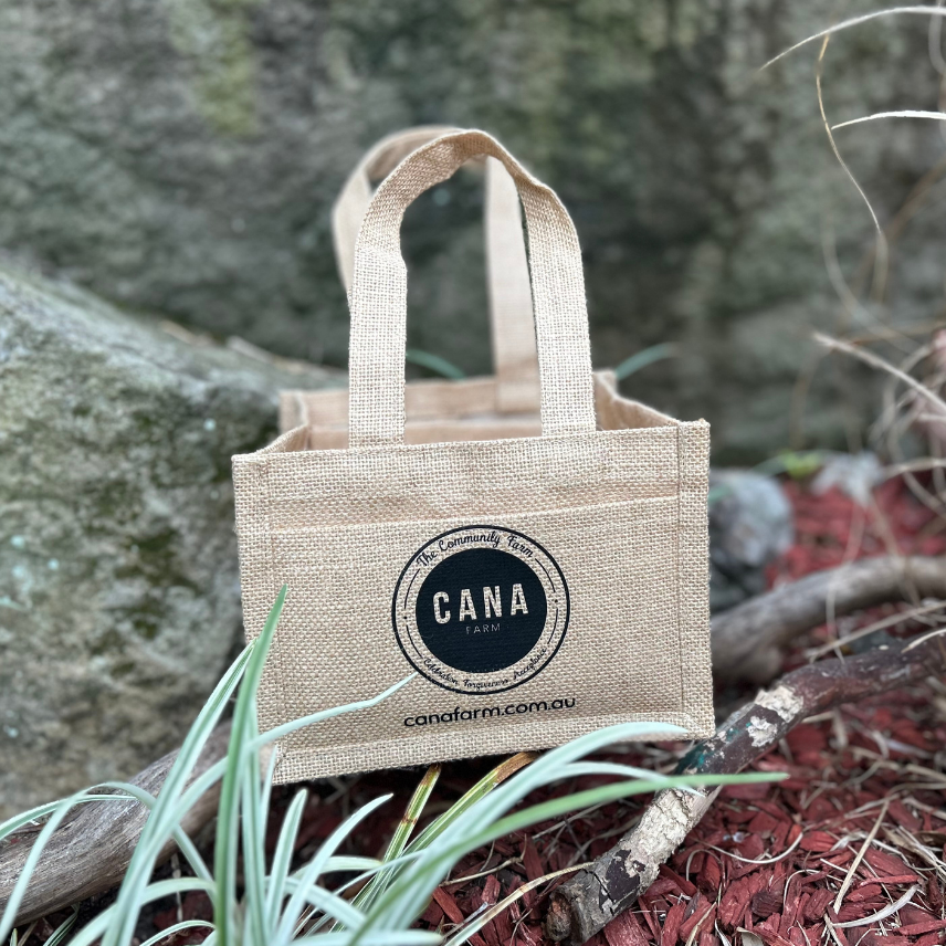 Jute bag with 'CANA' branding on a natural background